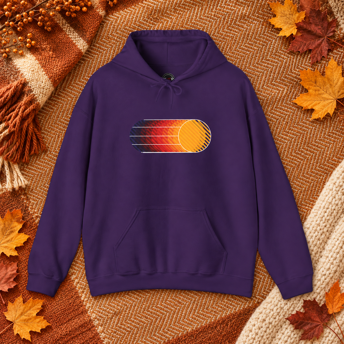 Purple Retro Sunset graphic hoodie styled in a warm autumn flat lay