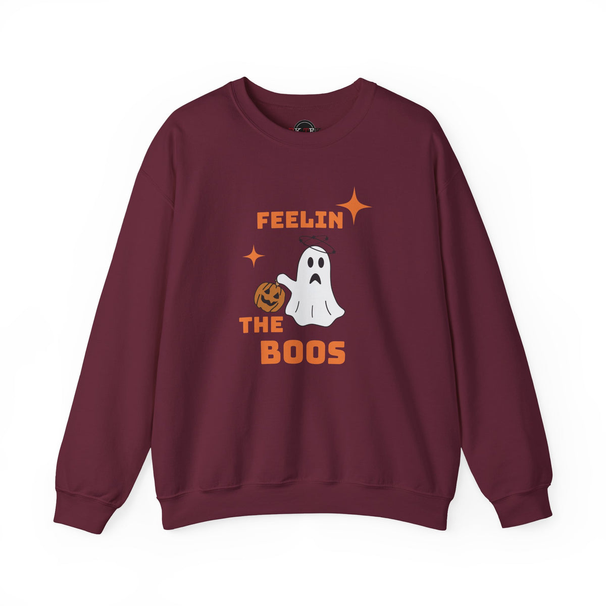 A maroon crewneck sweatshirt featuring a Halloween graphic with the text 'FEELIN THE BOOS' in orange, a white ghost, and an orange pumpkin, displayed on a clean white background.