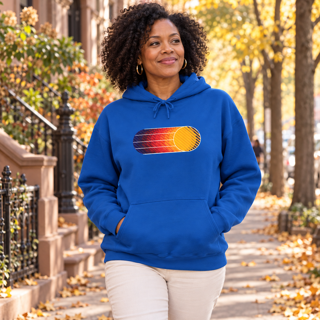 Female model wearing a Royal Retro Sunset graphic hoodie in New York during fall