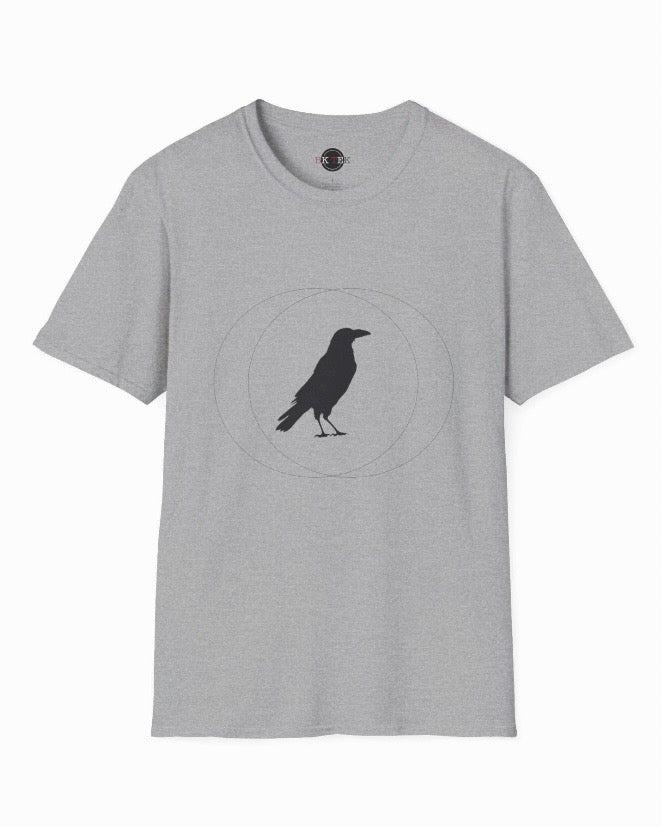 A light gray heather crewneck t-shirt featuring a black crow silhouette standing inside a thin circular graphic on the chest, displayed against a plain white background.