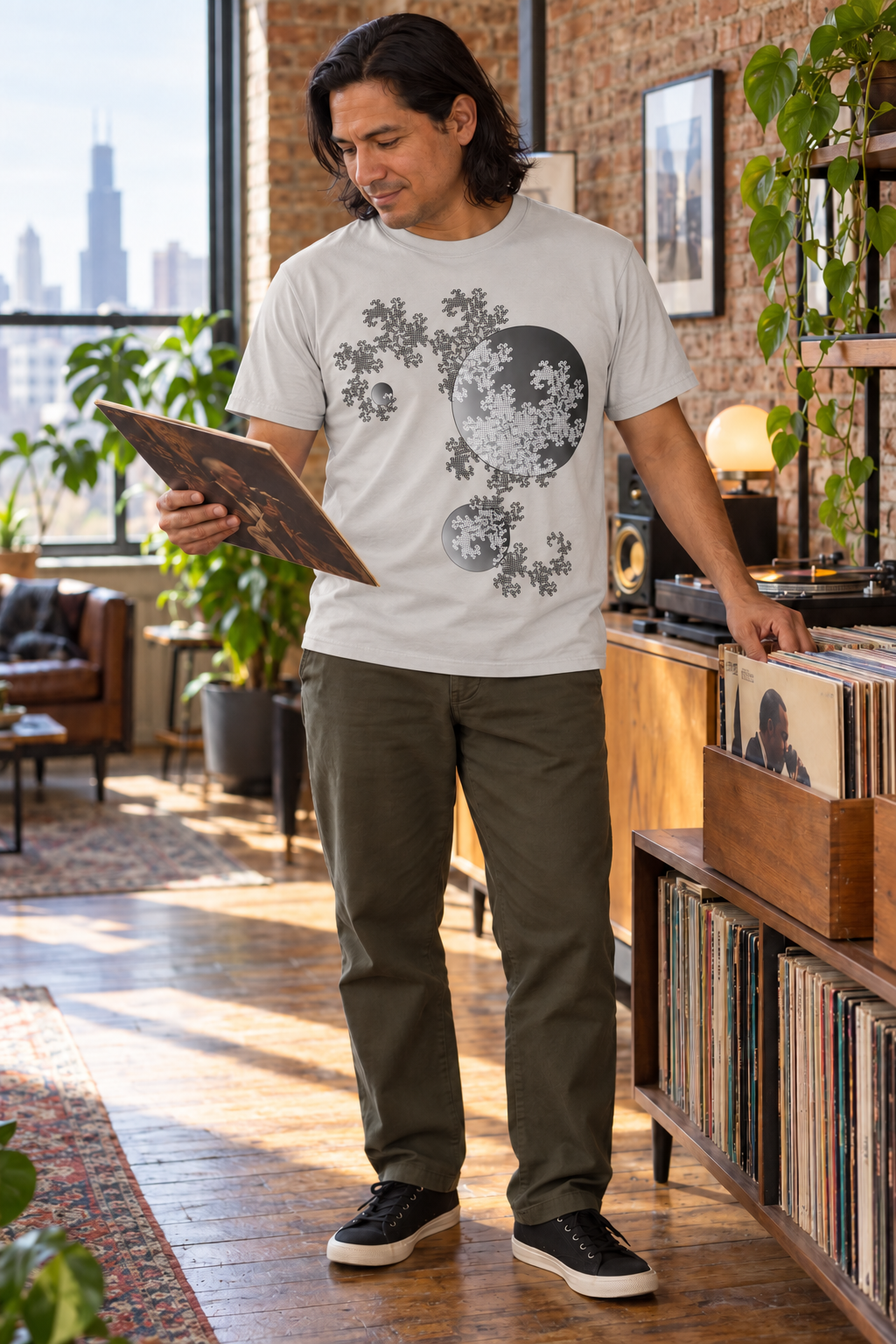 Man wearing a light gray Dragon Curve Fractal shirt in a bookshop