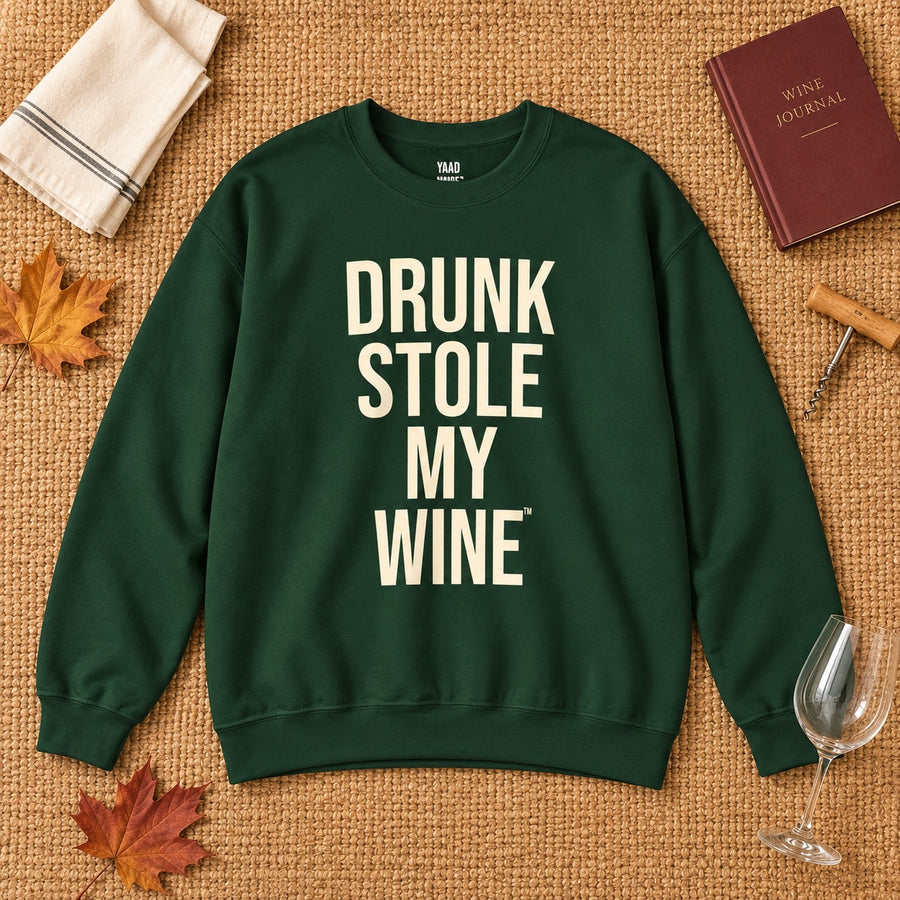 Drunk Stole My Wine sweatshirt in Forest Green styled in a warm early-autumn flat lay