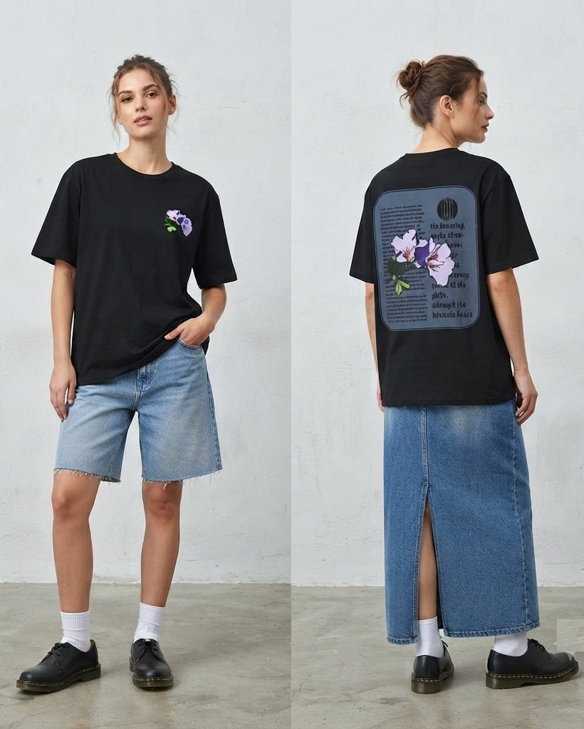 Front and back views of a black Flower Life shirt worn with denim shorts