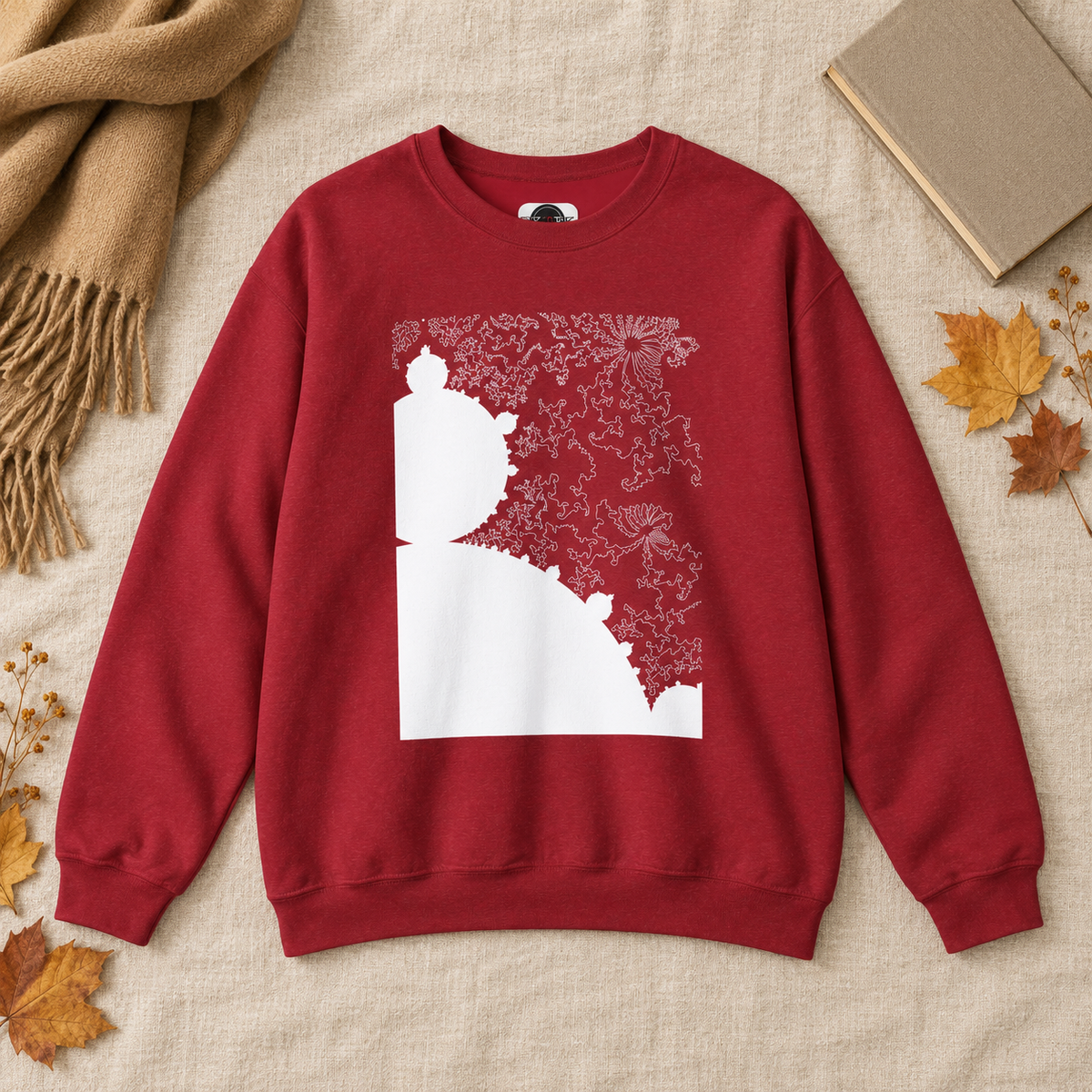 Mandelbrot fractal sweatshirt in Antique Cherry Red styled in a warm autumn flat lay