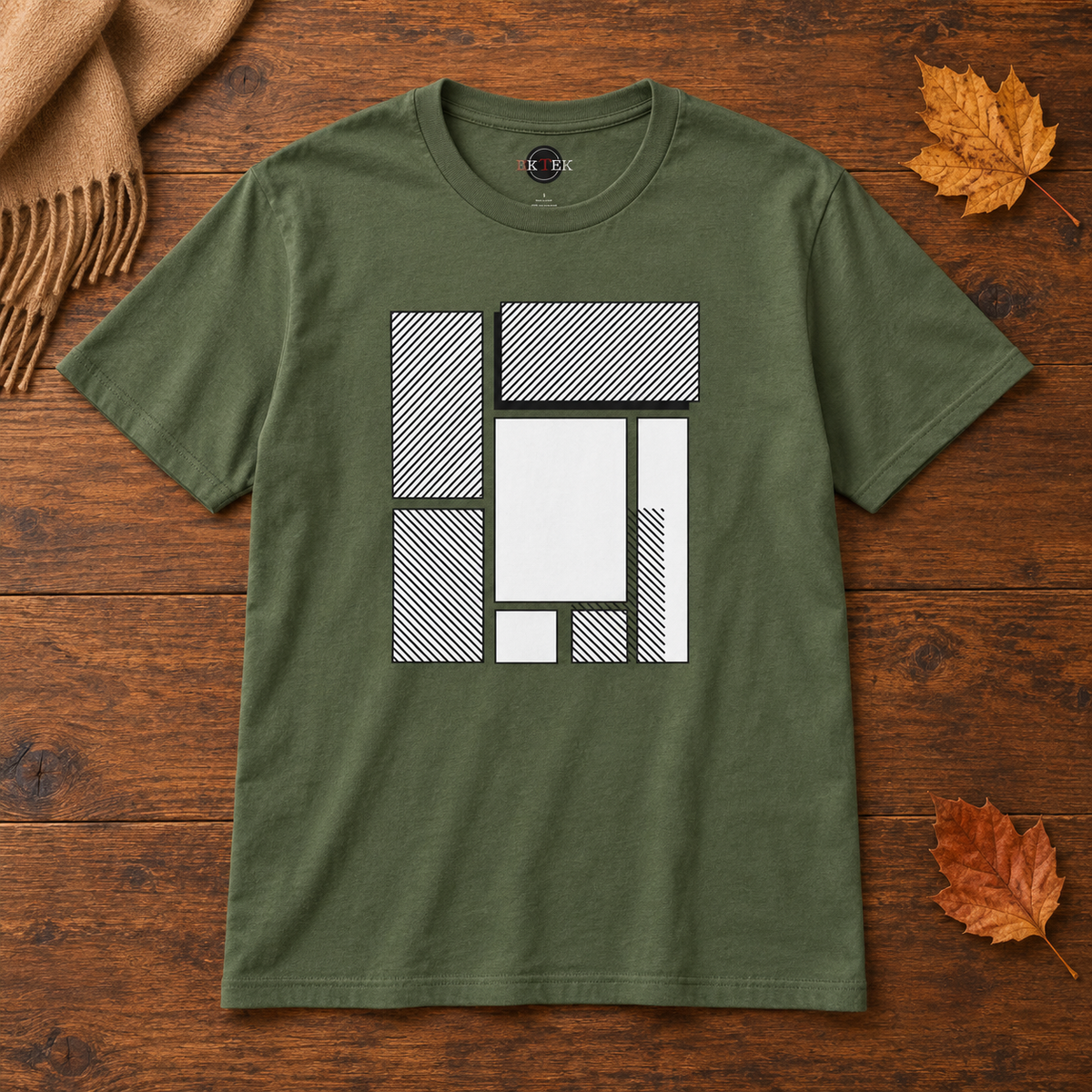 Green Minimalist Abstract Geometric shirt laid flat with autumn leaves