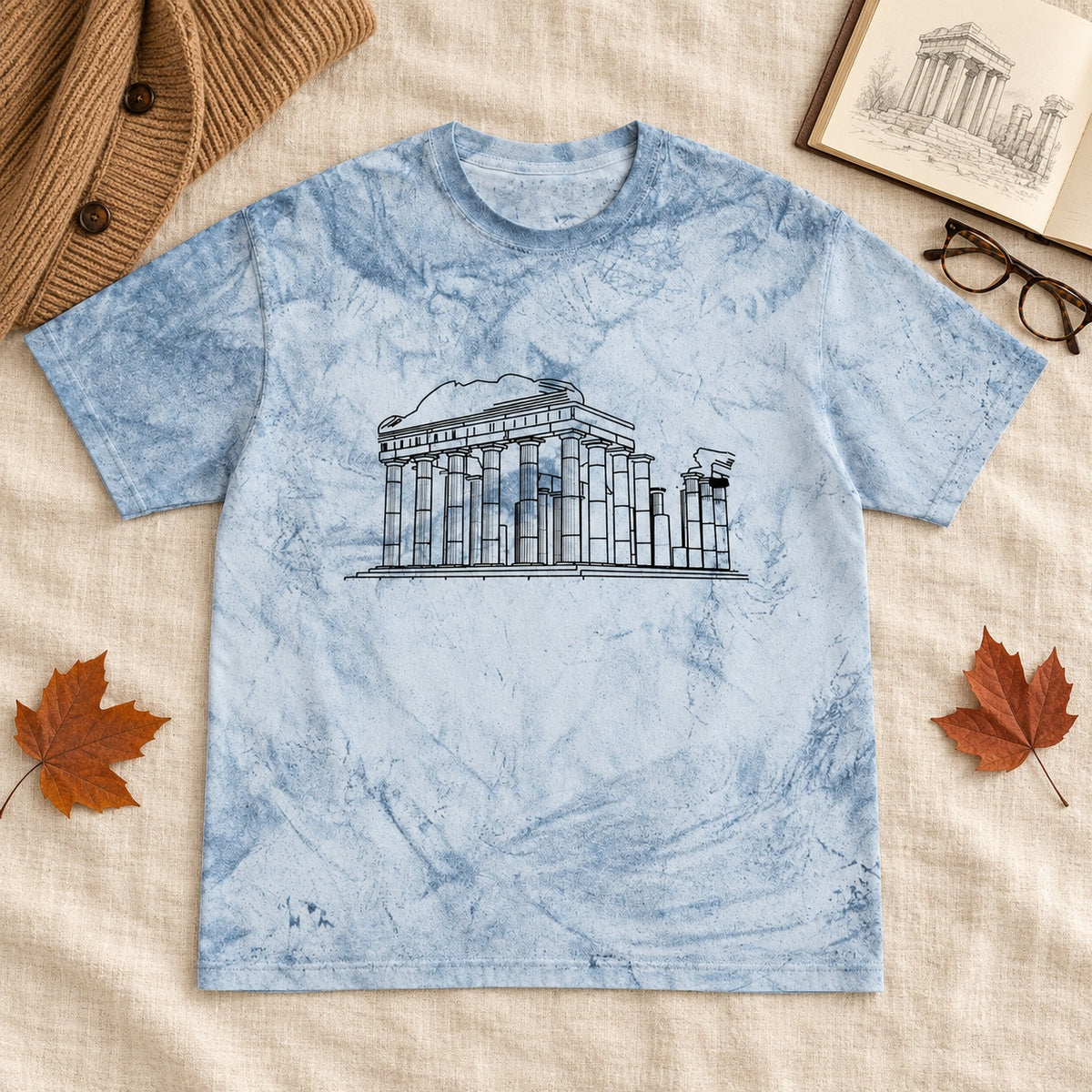 Blue tie-dye Roman Ruins shirt with architectural line art, laid flat