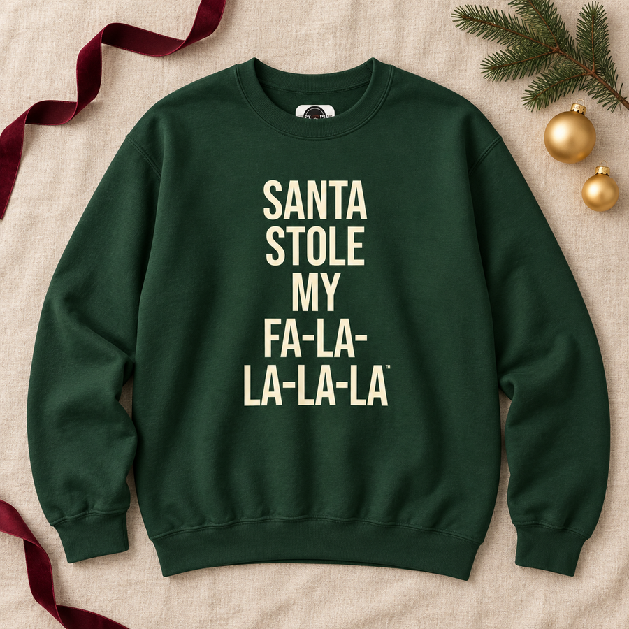Forest green Santa Stole My Fa-La-La-La-La sweatshirt laid flat with holiday decorations
