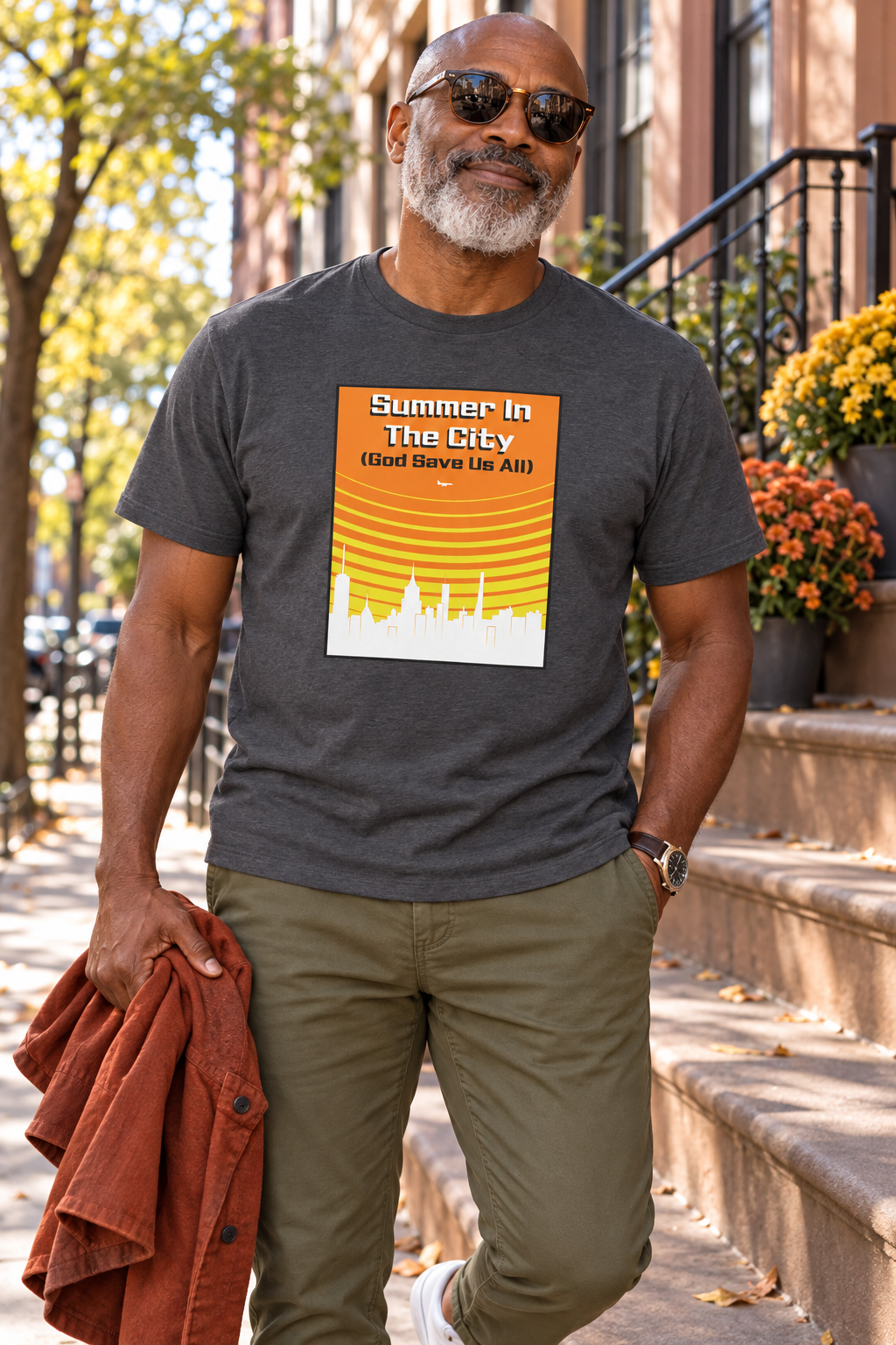 Man wearing a charcoal Summer in the City shirt on an autumn sidewalk