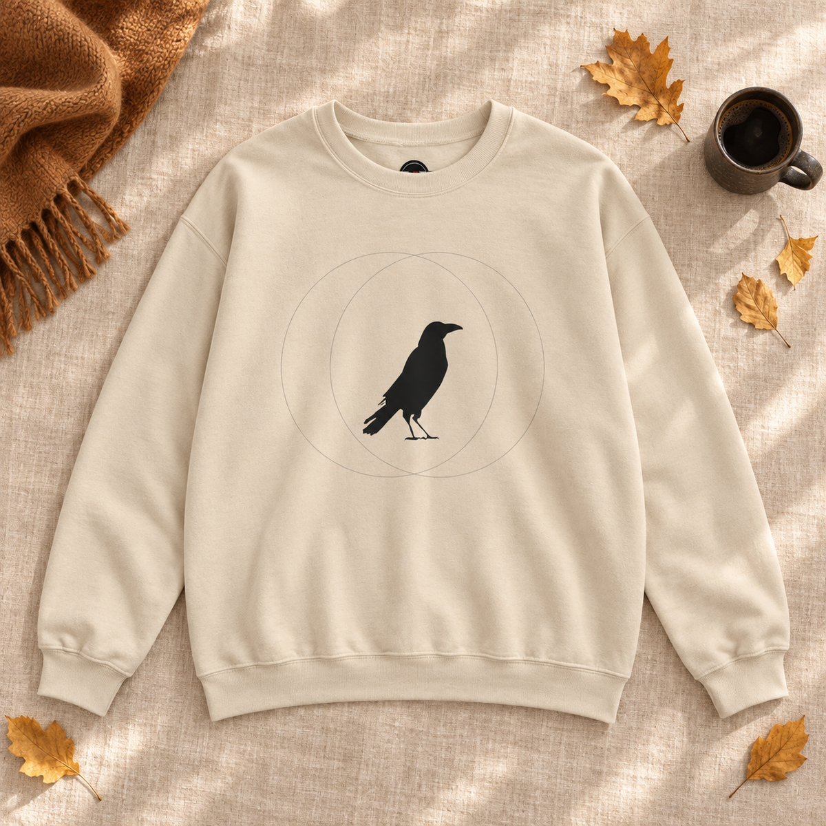 Sand Wise Crow sweatshirt in a warm autumn flat lay